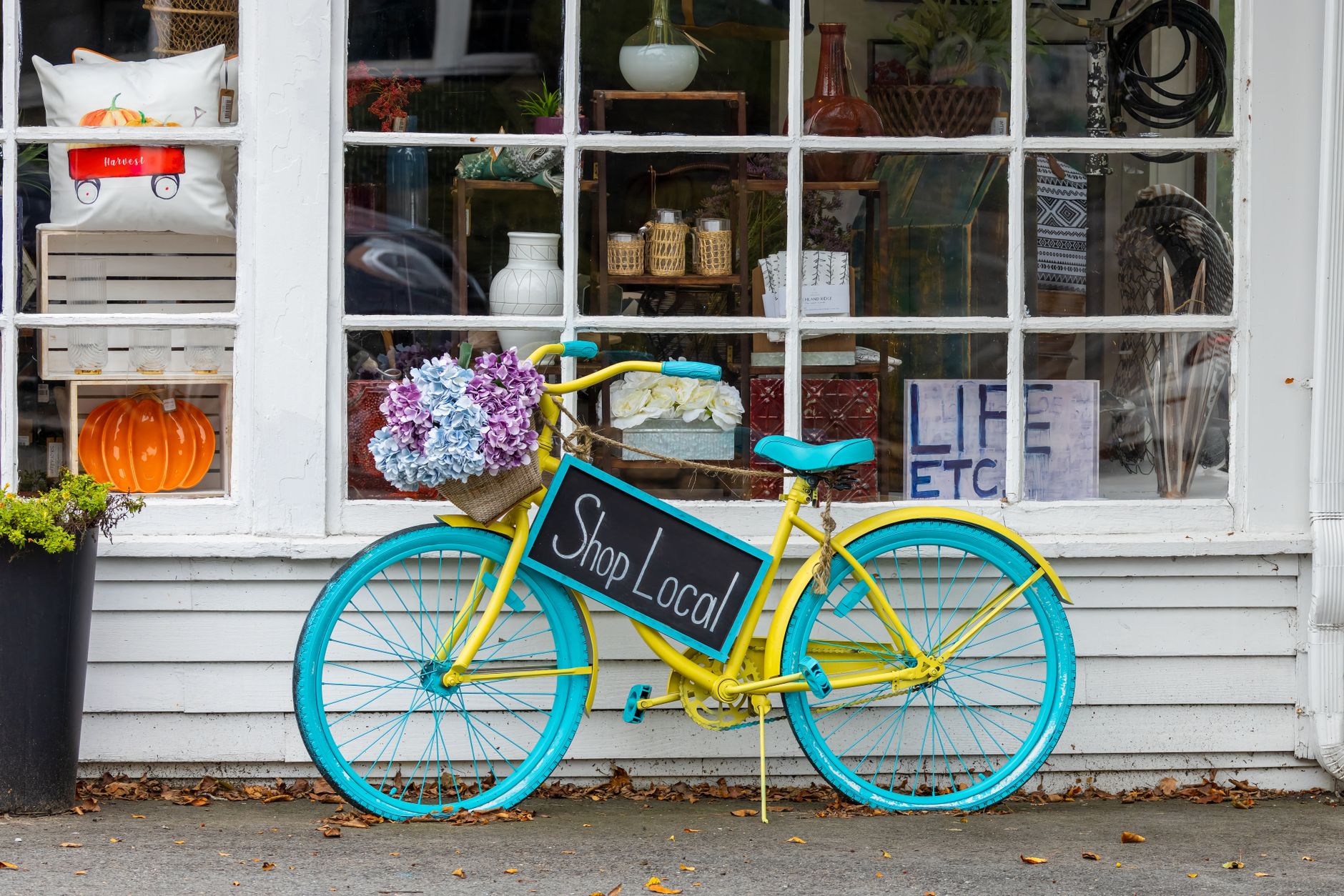 SaaS tools for new businesses. blue bicycle parked near glass wall of a store