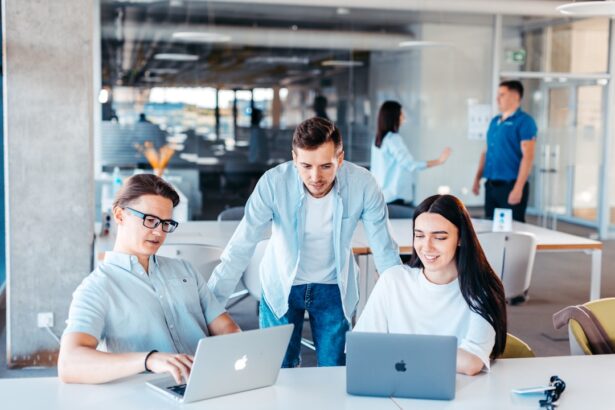 Startup team using business software on laptops